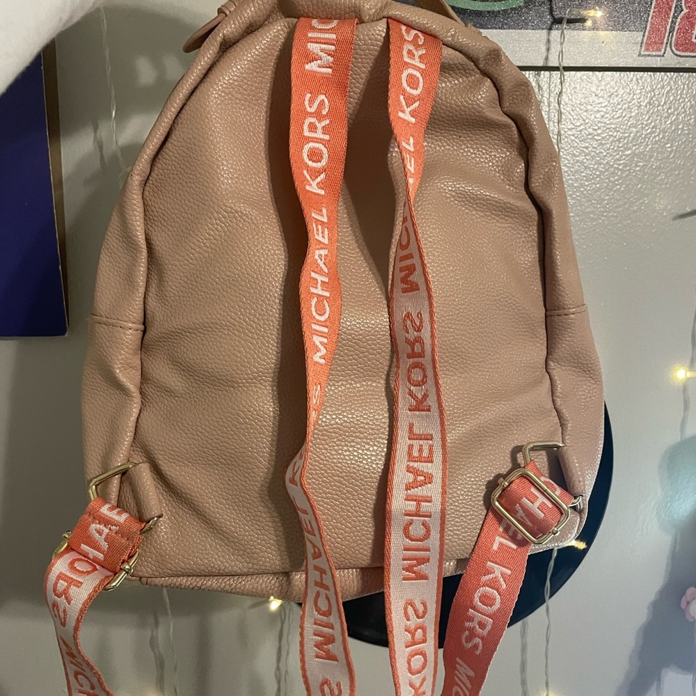 nude colored michael kors mini bag